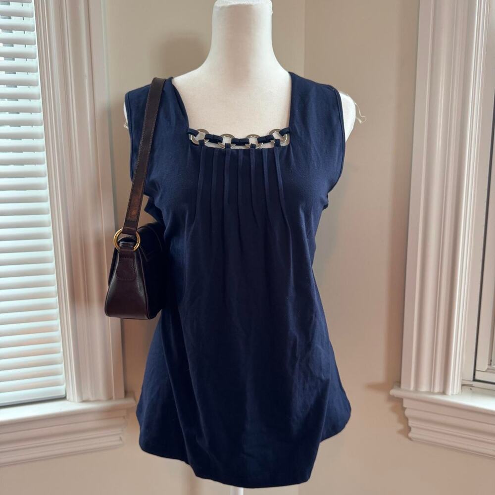 Requirements navy blue sleeveless blouse with circular embellishments